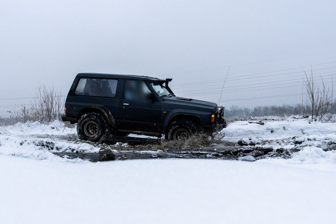 Nissan Patrol Y60 in de sneeuw